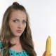 Beautiful Sexy Girl Eating a Banana On White - VideoHive Item for Sale