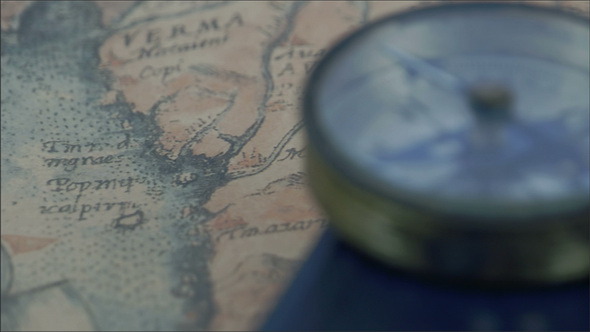 Compass and a Map on the Table