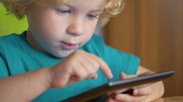 Portrait Of A Child With Tablet PC