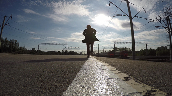 Silhouette of Man Running On Edge Of Platform
