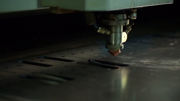 Machine Makes Hole In Metal Sheet By Laser Head
