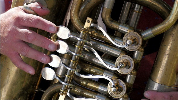 A Trumpet Being Played by a Man alt