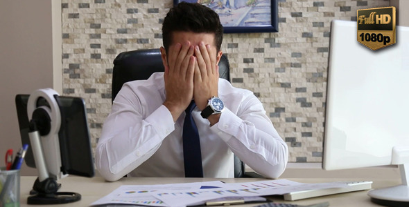 Stressed businessman at work