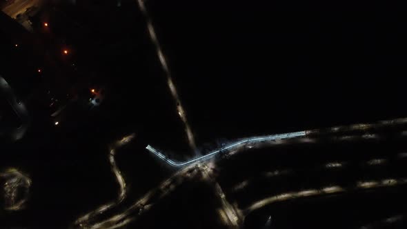 Night alleys elevated bridge in Kharkiv city park alt