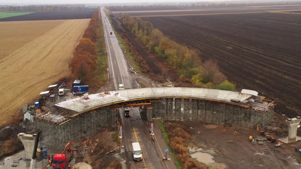 Panoramic Drone Shot Along Construction of Road Concrete Overpass alt