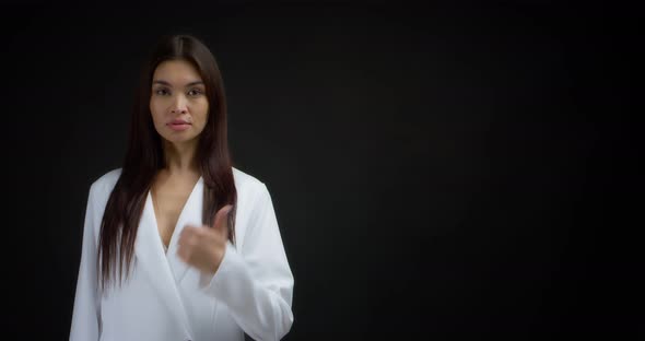 Woman Pointing to an Empty Space for your Advertising Content
