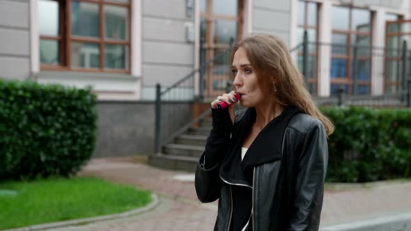 Beautiful Woman is Walking Alone and Smoking Cigarette Casual Street Style and Relax alt