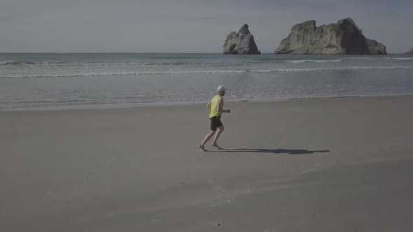 Running barefoot on beautiful beach