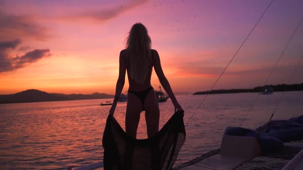 Girl Watching Sunset on The Boat bat flying
