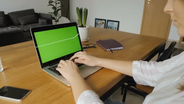 Entrepreneur Using Laptop With Green Screen