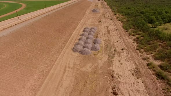 Drone shot of a dirt wall or border for a rock quarry alt
