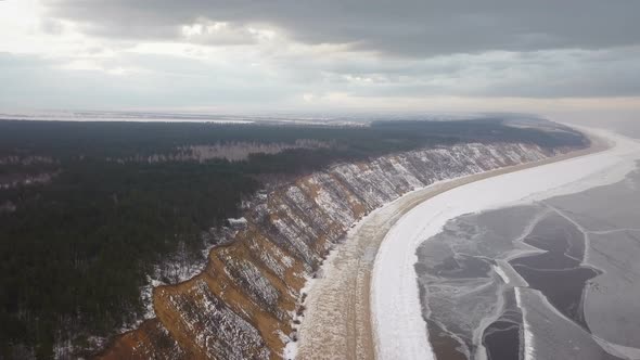 Frozen River Coast And Stormy Clouds