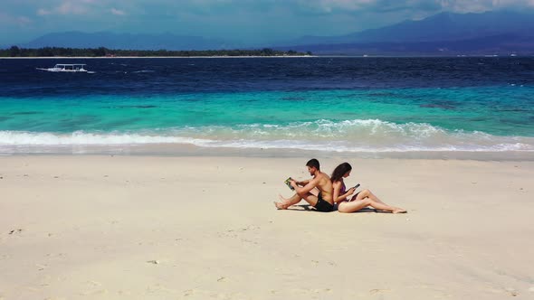 Young Man and Woman on Romantic Honeymoon Have Fun on Beach on Paradise White Sand alt