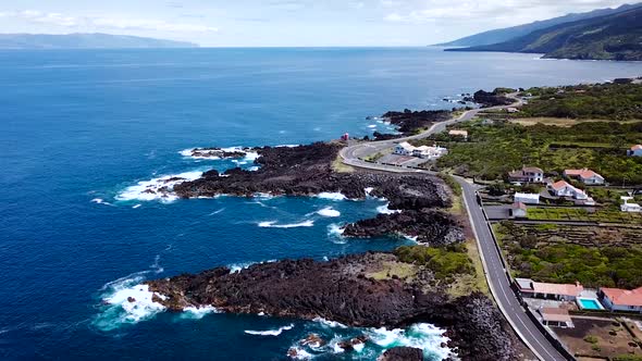 Aerial view of the rocky coast in São Roque do Pico in Pico Island, Azores. Beautiful Atlantic Ocean alt