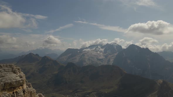 Dolomites in Val Gardena, Italy. Astonishing panorama, high mountain peaks with sky and clouds durin alt
