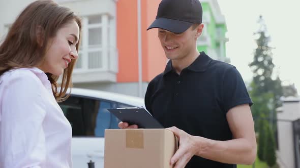 Delivery. Express Courier Delivering Package To Client Home alt