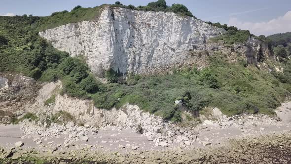 Flying parallel to the Rock formation of the Seaton beach in eastern Devon, England. These rock form alt