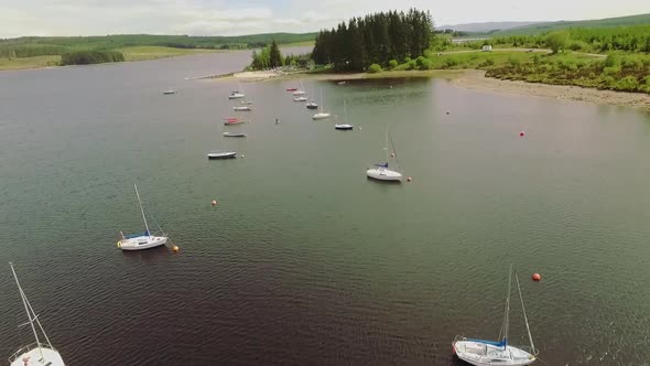 fishing boats moored in lake in north wales llyn brenig alt