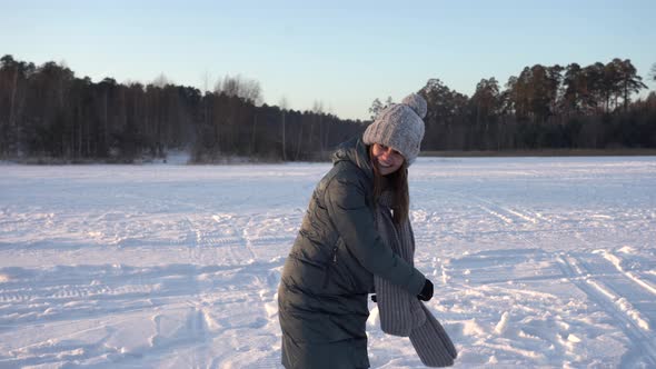Smiling Girl Enjoying Cold Sunny Evening in the Park alt