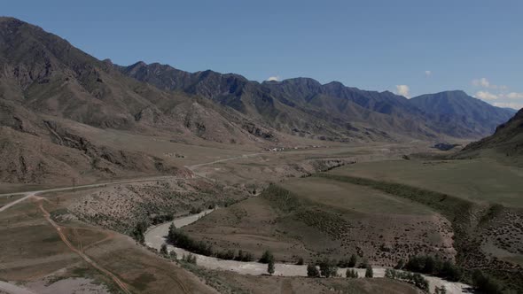 Mountains of Altai and Chuya river under clear blue sky