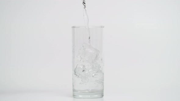 Super Slow Motion of Pouring Water in Glass with Ice at 1000 Fps alt