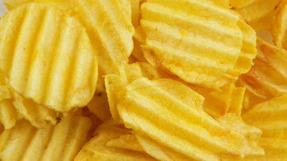 Ribbed potatoes snack chips close up