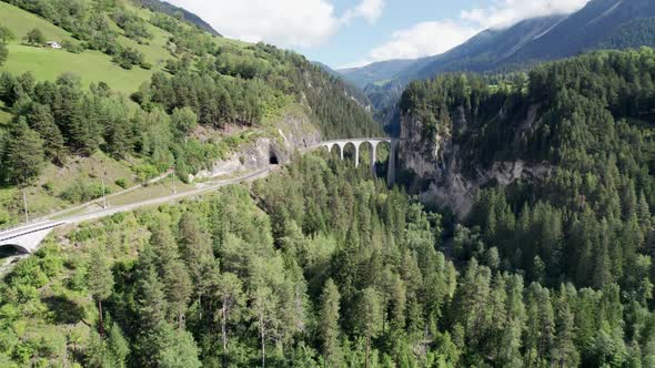 Landwasser Viaduct in Swiss Alps in Summer Aerial View on Green Mountain Valley alt