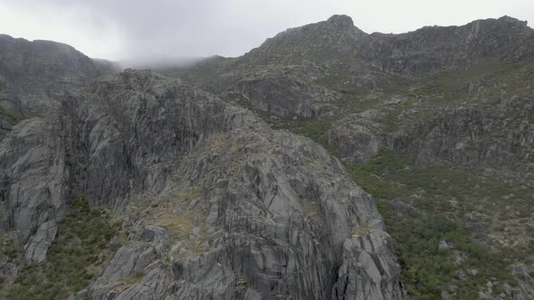 Rocky mountain at Covao da Ametade in Serra da Estrela, Portugal. Aerial flyback alt