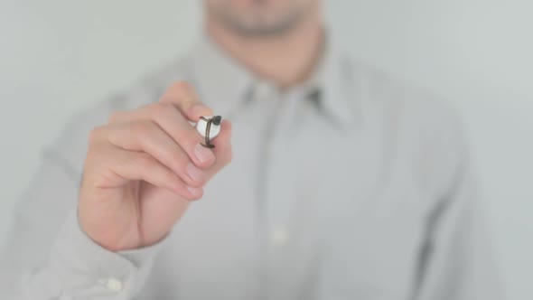 Accomplished Man Writing on Transparent Screen alt