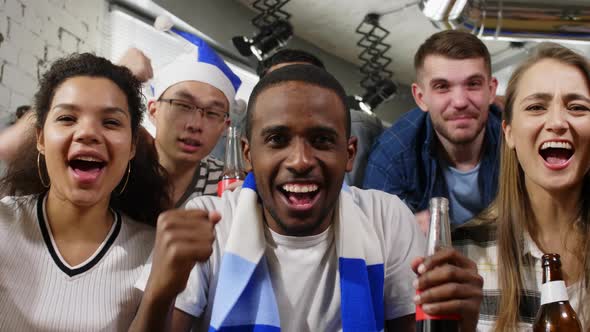 Mixed ethnic people shouting for sportsman