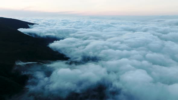 High altitude flight above fluffy cumulonimbus clouds, Bica da Cana, Madeira alt