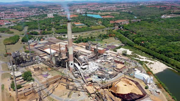 Toxic gas smoke from paper industrial factory. Air pollution. alt