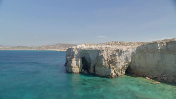 Flying Towards a Cave on an Aegean Sea Beach in the Island of Milos alt