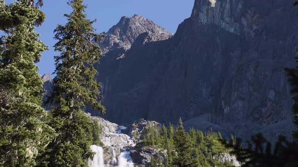 Waterfall Cascading Down a Rocky Mountain Cliff in Canadian Nature Landscape alt
