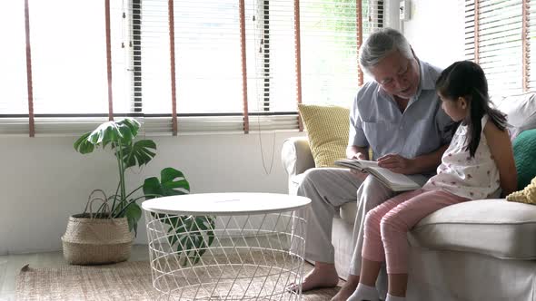 Senior man with girl at home alt