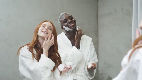 Beautiful Funny African European Couple in Love After Shower in Bathrobe
