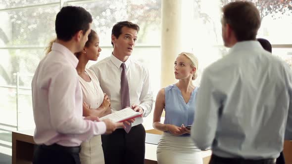 Business team leader offering encouragement during meeting