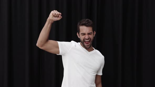 Cheering Man Punching Air alt