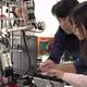 Engineer collaborating development robot in modern laboratory
