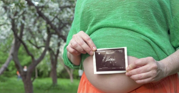 Pregnant Woman With Baby Ultrasound Scan Outdoor, Stock Footage | VideoHive