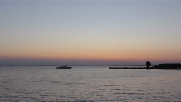 The Ship Sails On The Horizon On Pier