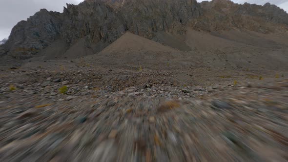 Speed Low Flight FPV Sports Drone Shot Over Stone Texture Hilly Endless Nature Terrain Epic Mountain alt