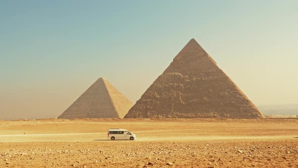Tourist Bus Drives to Pyramids on Giza Plateau alt