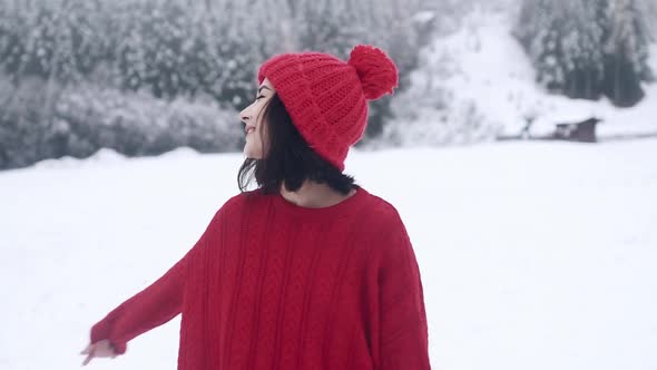 A Beautiful Smiling Girl in Winter in Slow Motion alt