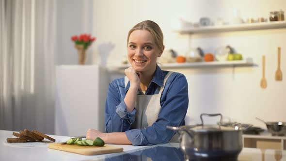 Happy Girl in Apron Smiling Into Camera, Healthy Nutrition, Homemade Recipes alt