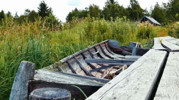 Obsolete Wooden Vessel Boat near Pier at Lake