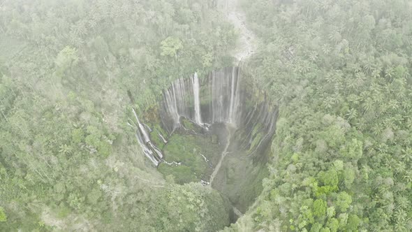 Drone Through Mist Over Tumpak Sewu Waterfalls alt