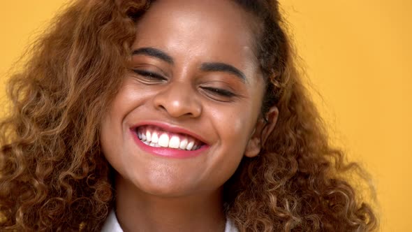Close up of cheerful attractive African American woman face smiling