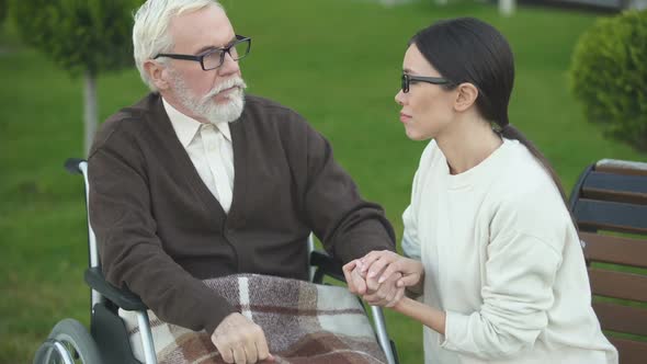 Lady Visiting Granddad in Nursing Home Veteran Suffering Post Traumatic Syndrome alt