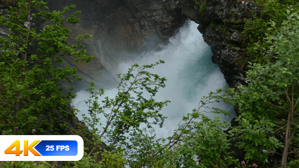 Waterfall in Mountain Forest